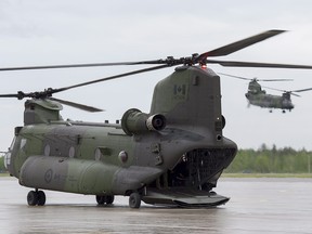 Two RCAF CH-147F Chinook, multi-mission, medium to heavy-lift helicopters are seen at CFB Bagotville in Bagotville, Que. on Thursday, June 7, 2018.