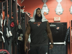 B.C. Lions offensive lineman Phillip Norman cleans out his locker at the team's training facility in Surrey in a 2019 file photo.