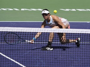 Miyu Kato, of Japan, returns a during a doubles semifinal match at the BNP Paribas Open tennis tournament Friday, March 17, 2023, in Indian Wells, Calif.