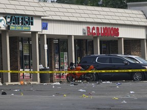 Police tape blocks an area at the scene of an overnight mass shooting at a strip mall in Willowbrook