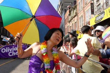 Toronto mayoral candidate Olivia Chow high-fives a spectator.