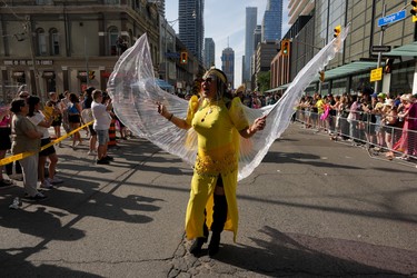 Participants walk in the Toronto Pride Parade.