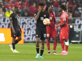 Canada's Charles Brym carries the ball back to the centre circle after an own goal by teammate Jacen Russell-Rowe ties the game for Guadeloupe during second half CONCACAF Gold Cup group stage action in Toronto, on Tuesday, June 27, 2023.THE CANADIAN PRESS/Chris Young