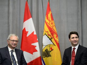 Prime Minister Justin Trudeau, right, meets with New Brunswick Premier Blaine Higgs