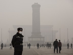 Police officer wearing mask on a very hazy day in Beijing, China