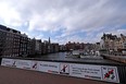 Amsterdam city centre with signs deterring people from smoking, drinking