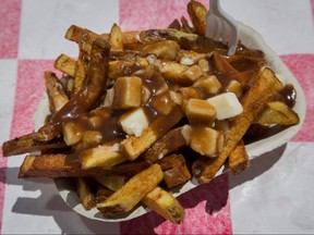 Overhead view of serving of poutine.