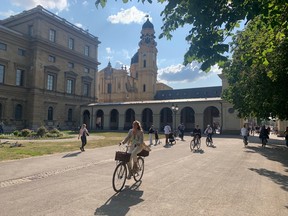 The wide bike paths and walking areas of The Hofgarten outside The Residenz.