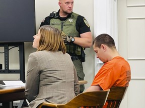 Majorjon Kaylor, 31, right, sits next to defenCe attorney Lisa Chesebro in a Wallace, Idaho, courtroom on Tuesday, June 20, 2023, during his first appearance on four murder charges.