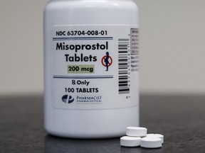 In this photo illustration, a bottle of Misoprostol tablets are displayed at a family planning clinic in Rockville, Md., April 13, 2023.