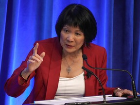 Olivia Chow gestures during a debate