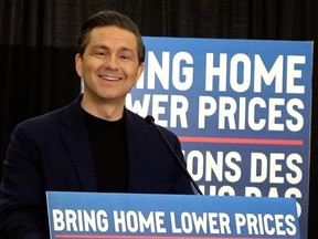 Pierre Poilievre smiles during a press conference