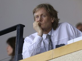 Winnipeg Jets co-owner David Thomson watches his team take on the Anaheim Ducks in the second period of NHL playoff action at MTS Centre in Winnipeg, Man., on Mon., April 20, 2015. Kevin King/Winnipeg Sun/Postmedia Network