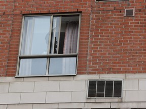 The broken window of a fourth-floor room at the Holiday Inn Express hotel on Lombard St. just west of Jarvis St. after a man tossed out objects and then fell to his death on Thursday June 15, 2023.