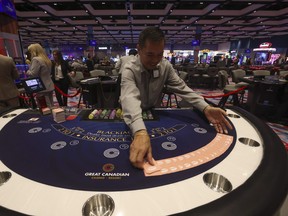 A dealer spreads out cards at a casino.