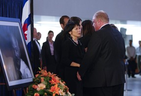 Toronto Mayor Rob Ford speaks with widow Olivia Chow at visitation for late NDP leader Jack Layton at City Hall in Toronto on Aug. 26, 2011.