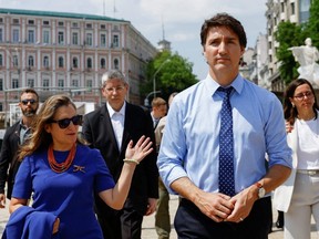 Prime Minister Justin Trudeau and Minister of Finance Chrystia Freeland walk together on the day of their visit at the Wall of Remembrance to pay tribute to Ukrainian soldiers killed amid Russia's attack on Ukraine, in Kyiv, Saturday, June 10, 2023.