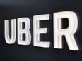 In this file photo taken Feb. 5, 2018, the Uber logo is seen outside the Uber Corporate Headquarters building in San Francisco.