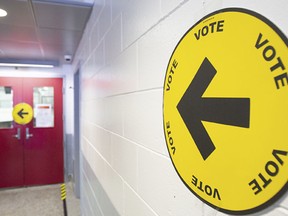 An arrow points to where people can go to cast their ballots for the election.