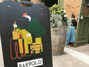 Exterior shot of Bar Volo sign and patio.