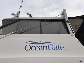 The logo for OceanGate Expeditions is seen on a boat parked near the offices of the company
