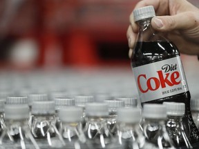 A bottle of Diet Coke is pulled for a quality control test at a Coco-Cola bottling plant