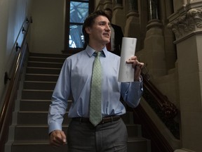 Prime Minister Justin Trudeau speaks briefly with reporters