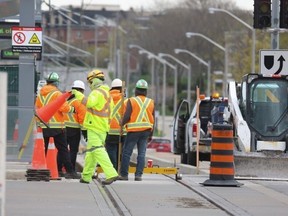 Workers are pictured on the Eglinton Crosstown LRT line.