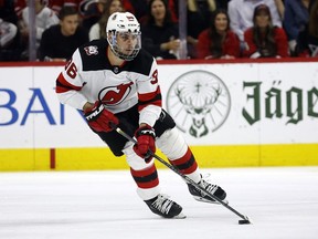 FILE - New Jersey Devils' Timo Meier (96) skates with the puck against the Carolina Hurricanes during the first period of Game 2 of an NHL hockey Stanley Cup second-round playoff series in Raleigh, N.C., May 5, 2023. The Devils announced Wednesday, June 28, that the team has agreed to terms with restricted free agent winger Meier on an eight-year contract worth $70.4 million.