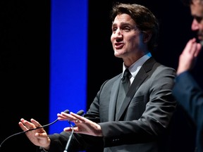 Justin Trudeau gestures with his hands.