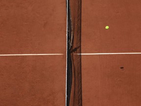 The ball passes over the net during the quarter final match of the French Open tennis tournament between Karolina Muchova of the Czech Republic and Russia's Anastasia Pavlyuchenkova at the Roland Garros stadium in Paris, Tuesday, June 6, 2023.