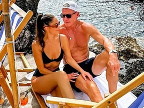 Haley Clark and Troy Aikman sunbathing in Italy.