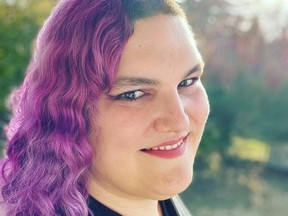 Transgender woman with purple hair