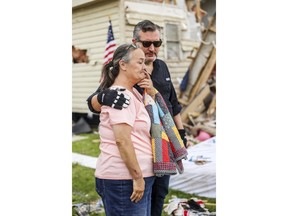 U.S. Sen. Ted Cruz, R-Texas, consoles a woman as he surveys the damage of her home from a recent tornado in Perryton, Texas, Saturday, June 17, 2023.