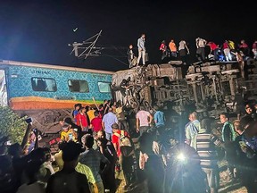 Rescuers work at the site of passenger trains that derailed in Balasore district, in the eastern Indian state of Orissa, Friday, June 2, 2023.