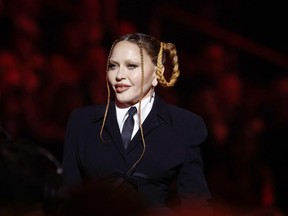 Madonna speaks onstage during the 65th GRAMMY Awards - Getty