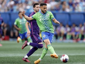 Seattle Sounders midfielder Cristian Roldan (7) scores a goal during an MLS soccer match against the Charlotte FC, Saturday, June 10, 2023, in Charlotte, N.C.