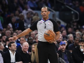 FILE - Referee Eric Lewis gestures during the first half of Game 5 of the NBA basketball Eastern Conference semifinal between the New York Knicks and the Miami Heat on May 10, 2023, in New York. Lewis was not selected as one of the 12 referees who will work the NBA Finals between the Denver Nuggets and Miami Heat, while the league continues to look into whether he used a Twitter account to defend himself and other officials from online critiques. Lewis had been chosen to work the finals in each of the last four seasons.