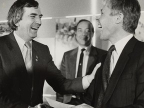 Federal Sports Minister Jacques Olivier, left, presents a cheque to chairman of the Calgary Olympic Development Association Bob Niven at a ceremony in Calgary on March 30, 1984. Niven, who was president of the bid committee for the 1988 Calgary Winter Games, died May 26 at the age of 80. Niven was vice-chair of the organizing committee and served as mayor of the Olympic village during the Games. Canada Olympic Park named its high-performance training facility in his honour.