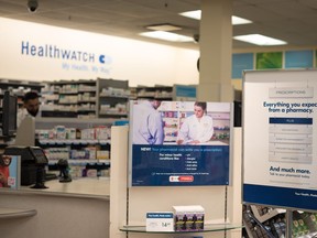 Signage explaining that Ontario pharmacists are able to provide prescriptions for minor health conditions is photographed at a Shoppers Drug Mart pharmacy in Etobicoke, Jan. 11, 2023.