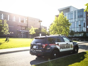 A Waterloo Regional Police vehicle is seen at the scene of a stabbing at the University of Waterloo, in Waterloo, Ont., Wednesday, June 28, 2023. Canadian universities and colleges should be reassessing their security measures after a professor and two students were stabbed in a classroom west of Toronto in an attack police say was motivated by hate, a free speech expert says.