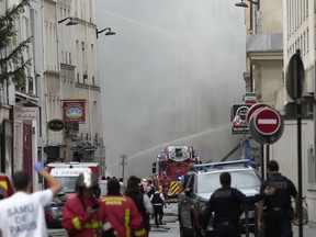Firemen use a water cannon in Paris