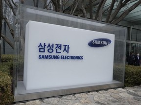The logo of the Samsung Electronics Co. is seen at its office in Seoul, South Korea on Jan. 31, 2023. South Korean prosecutors have arrested and indicted a former executive of Samsung Electronics suspected of stealing trade secrets while attempting to establish a copycat computer chip plant in China.