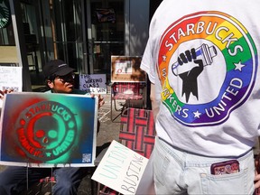 People picket in front of a Starbucks store in Chicago