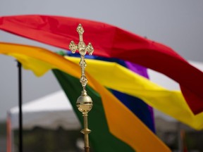 A cross is seen during a pride worship service