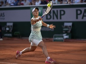 Canada's Bianca Andreescu returns the ball to Ukraine's Lesia Tsurenko during their third round match of the French Open tennis tournament at the Roland Garros stadium in Paris, Saturday, June 3, 2023.