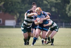 Non-binary rugby player Ash, who identifies as female, makes tackle for the Fergus Highlanders in a game against the Stoney Creek Camels on June 17. (Brayden Swire photo)