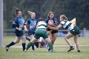 Non-binary rugby player Number 8 for the Fergus Highlanders women's rugby squad's trans player Ash makes a tackle against against the Stoney Creek Camels June 17 -- Brayden Swire photo