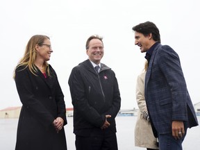 Prime Minister Justin Trudeau is greeted by Hlynur Gudjonsson, Ambassador of Iceland to Canada, and Jeannette Menzies, Ambassador of Canada to Iceland, as he arrives in Keflavik, Iceland, on Sunday, June 25, 2023. Trudeau is in Iceland to attending the Nordic Prime Ministers' Meeting.