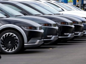 New cars are displayed at a sales lot in San Leandro, Calif., May 30, 2023.